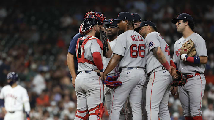 Mar 31, 2026; Houston, Texas, USA;  Boston Red Sox starting pitcher Brayan Bello (66) gets a mound visit against the Houston Astros in the fifth inning at Daikin Park. Mandatory Credit: Thomas Shea-Imagn Images