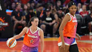 Team WNBA stars Caitlin Clark and Angel Reese run down the court during the All-Star game.