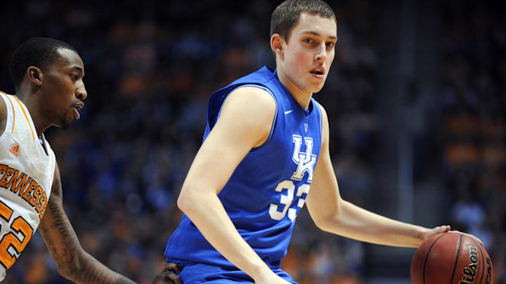 Mar 16, 2013; Knoxville, TN, USA; Kentucky Wildcats forward Kyle Wiltjer (33) brings the ball up court against Tennessee Volunteers guard Jordan McRae (52) during the first half at Thompson-Boling Arena. Mandatory Credit: Randy Sartin-Imagn Images