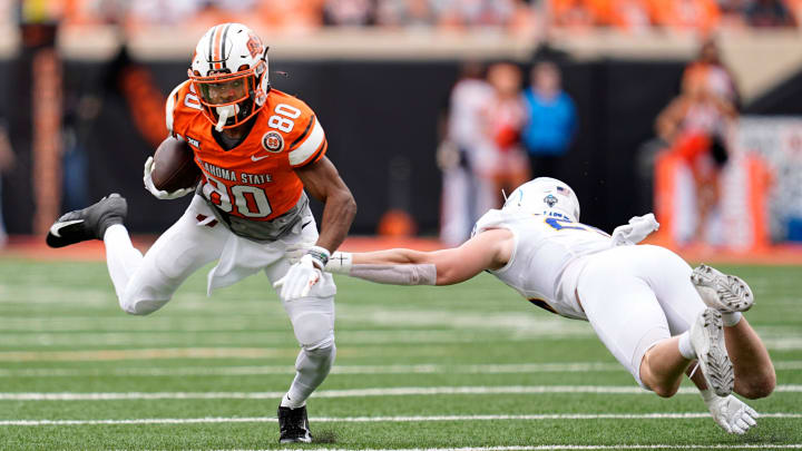 Oklahoma State's Brennan Presley (80) gets by South Dakota State's Myles Taylor (2) in the first half of the college football game between the Oklahoma State Cowboys and South Dakota State Jackrabbits at Boone Pickens Stadium in Stillwater, Okla., Saturday, Aug., 31, 2024.