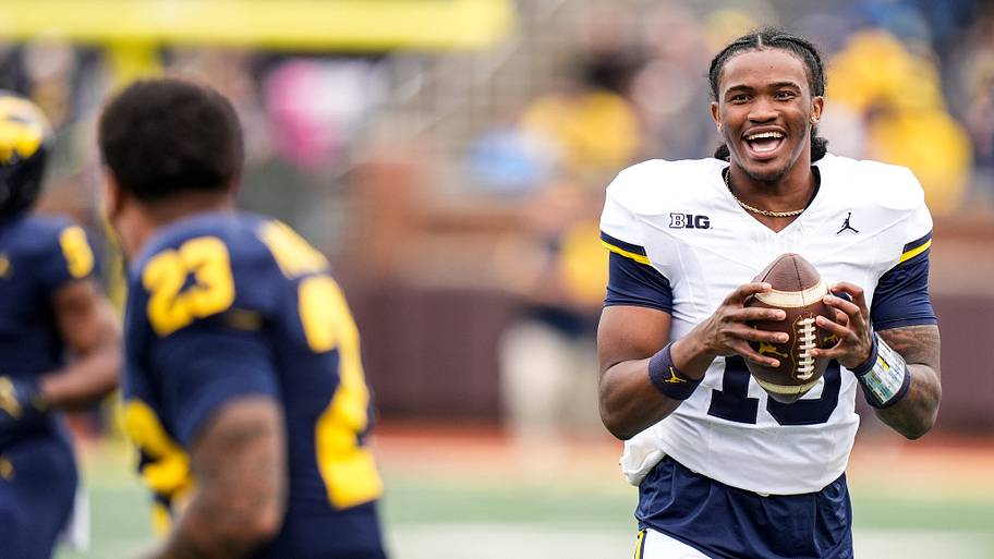 Michigan quarterback Bryce Underwood shares a laugh with running back Jordan Marshall during the spring game.