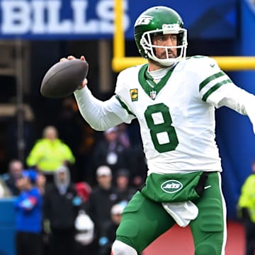 Dec 29, 2024; Orchard Park, New York, USA; New York Jets quarterback Aaron Rodgers (8) throws a pass in the first quarter against the Buffalo Bills at Highmark Stadium. Mandatory Credit: Mark Konezny-Imagn Images