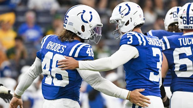 Indianapolis Colts long snapper Luke Rhodes congratulates kicker Spencer Shrader after a made field goal.