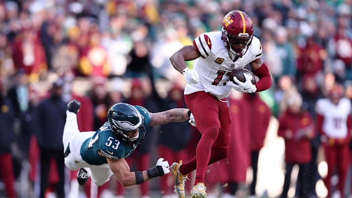 Washington Commanders wide receiver Terry McLaurin evades Philadelphia Eagles linebacker Zack Baun during the NFC playoffs