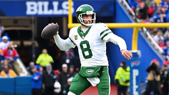 Dec 29, 2024; Orchard Park, New York, USA; New York Jets quarterback Aaron Rodgers (8) throws a pass in the first quarter against the Buffalo Bills at Highmark Stadium. Mandatory Credit: Mark Konezny-Imagn Images