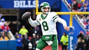 Dec 29, 2024; Orchard Park, New York, USA; New York Jets quarterback Aaron Rodgers (8) throws a pass in the first quarter against the Buffalo Bills at Highmark Stadium. Mandatory Credit: Mark Konezny-Imagn Images