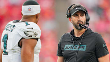 Philadelphia Eagles head coach Nick Sirianni speaks with quarterback Jalen Hurts (1) during the fourth quarter of the game against the Kansas City Chiefs at GEHA Field at Arrowhead Stadium.