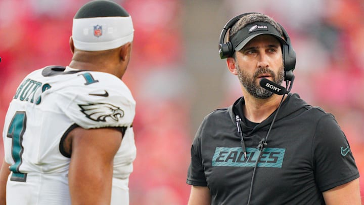Philadelphia Eagles head coach Nick Sirianni speaks with quarterback Jalen Hurts (1) during the fourth quarter of the game against the Kansas City Chiefs at GEHA Field at Arrowhead Stadium.