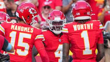 Sep 15, 2024; Kansas City, Missouri, USA; Kansas City Chiefs wide receiver Rashee Rice (4) celebrates after scoring against the Cincinnati Bengals during the game at GEHA Field at Arrowhead Stadium. Mandatory Credit: Denny Medley-Imagn Images