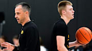 Iowa men’s basketball head coach Ben McCollum passes Bennett Stirtz (14) during practice June 19, 2025 at Carver-Hawkeye Arena in Iowa City, Iowa.