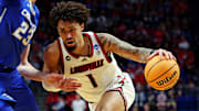 Mar 20, 2025; Lexington, KY, USA; Louisville Cardinals guard J'Vonne Hadley (1) drives to the basket against Creighton Bluejays forward Jackson McAndrew (23) during the second half in the first round of the NCAA Tournament at Rupp Arena. Mandatory Credit: Jordan Prather-Imagn Images