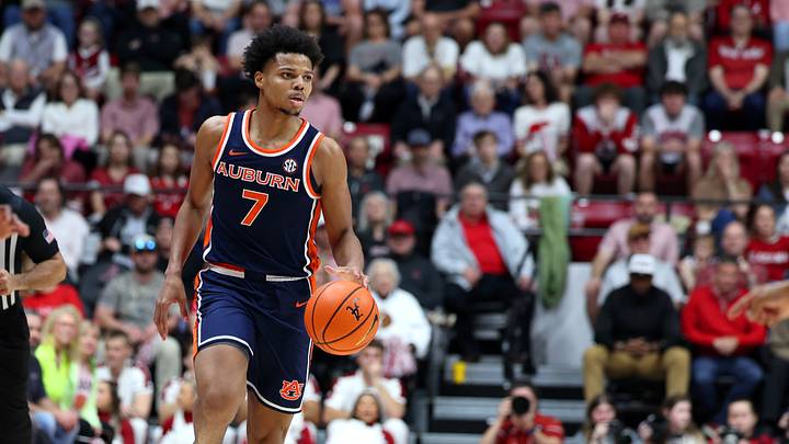 Mar 7, 2026; Tuscaloosa, Alabama, USA; Auburn Tigers forward Keyshawn Hall (7) dribbles the ball during the first half against the Alabama Crimson Tide at Coleman Coliseum.