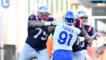 Nov 17, 2024; Foxborough, Massachusetts, USA; New England Patriots offensive tackle Demontrey Jacobs (75) blocks Los Angeles Rams defensive tackle Kobie Turner (91) during the first half at Gillette Stadium. Mandatory Credit: Eric Canha-Imagn Images