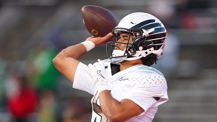 Oct 18, 2025; Piscataway, New Jersey, USA; Oregon Ducks quarterback Dante Moore (5) warms up before the game against the Rutgers Scarlet Knights at SHI Stadium. Mandatory Credit: Vincent Carchietta-Imagn Images