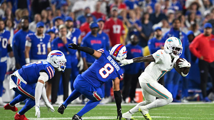 Sep 18, 2025; Orchard Park, New York, USA; Miami Dolphins wide receiver Tyreek Hill (10) runs against Buffalo Bills linebacker Terrel Bernard (8) in the first half at Highmark Stadium. Mandatory Credit: Mark Konezny-Imagn Images