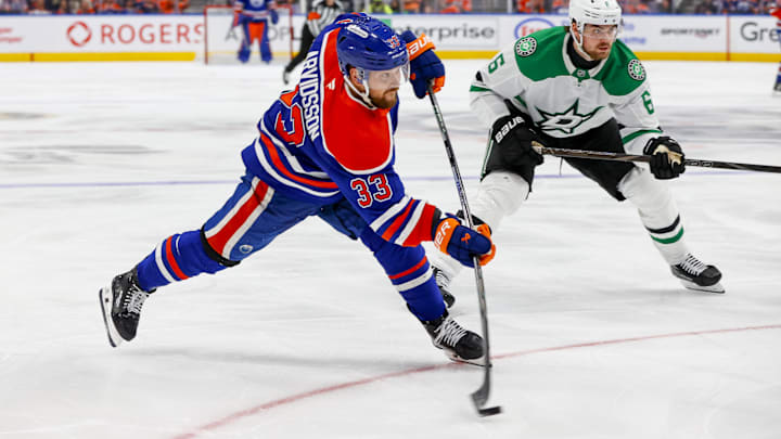 May 27, 2025; Edmonton, Alberta, CAN; Edmonton Oilers left wing Viktor Arvidsson (33) shots the puck past Dallas Stars defenseman Lian Bichsel (6) during the third period in game four of the Western Conference Final of the 2025 Stanley Cup Playoffs at Rogers Place. Mandatory Credit: Perry Nelson-Imagn Images May 27, 2025; Edmonton, Alberta, CAN; Edmonton Oilers left wing Viktor Arvidsson (33) shots the puck past Dallas Stars defenseman Lian Bichsel (6) during the third period in game four of the Western Conference Final of the 2025 Stanley Cup Playoffs at Rogers Place. Mandatory Credit: Perry Nelson-Imagn Images