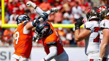 September 22, 2024, Tampa, Florida, USA: Denver Broncos defensive end Zach Allen (99) and defensive tackle Malcolm Roach (97) celebrate, after they sack Tampa Bay Buccaneers quarterback Baker Mayfield (6) during the fourth quarter at Raymond James Stadium in Tampa on Sunday, Sept. 22, 2024. 