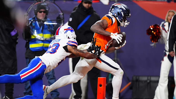 Jan 17, 2026; Denver, CO, USA; Denver Broncos wide receiver Marvin Mims Jr. (19) catches a touchdown against Buffalo Bills cornerback Dane Jackson (23) during the fourth quarter of an AFC Divisional Round playoff game at Empower Field at Mile High. Mandatory Credit: Ron Chenoy-Imagn Images