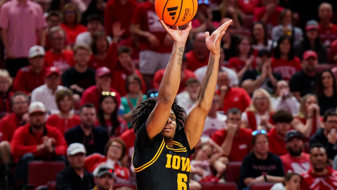 Mar 8, 2026; Lincoln, Nebraska, USA; Iowa Hawkeyes guard Tavion Banks (6) shoots a three-point basket against the Nebraska Cornhuskers during the second half at Pinnacle Bank Arena. Mandatory Credit: Dylan Widger-Imagn Images