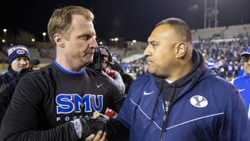 BYU coach Kalani Sitake (right) shakes the hand of SMU coach Rhett Lashlee after defeating the Mustangs at University Stadium Albuquerque.