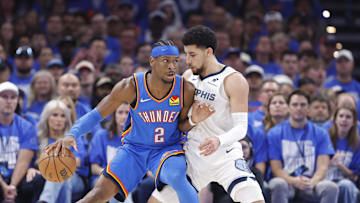 Apr 22, 2025; Oklahoma City, Oklahoma, USA; Oklahoma City Thunder guard Shai Gilgeous-Alexander (2) moves the ball against Memphis Grizzlies guard Scotty Pippen Jr. (1) in the third quarter during game two of first round for the 2024 NBA Playoffs at Paycom Center. Mandatory Credit: Alonzo Adams-Imagn Images