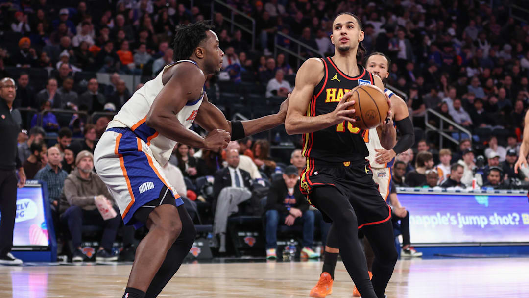 Jan 2, 2026; New York, New York, USA;  Atlanta Hawks forward Zaccharie Risacher (10) looks to drive past New York Knicks forward Og Anunoby (8) in the third quarter at Madison Square Garden. Mandatory Credit: Wendell Cruz-Imagn Images