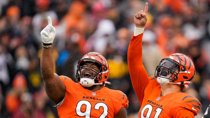 Cincinnati Bengals defensive end Trey Hendrickson (91) celebrates a sack with defensive tackle BJ Hill (92) in the first quarter of the NFL Week 12 game between the Cincinnati Bengals and the Pittsburgh Steelers at Paycor Stadium in Cincinnati on Sunday, Nov. 26, 2023.