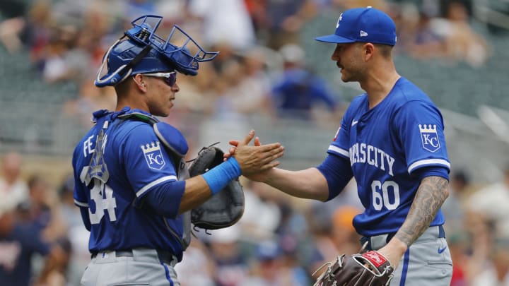 Aug 14, 2024; Minneapolis, Minnesota, USA; Kansas City Royals catcher Freddy Fermin (34) and relief pitcher Lucas Erceg (60) celebrate after defeating the Minnesota Twins at Target Field. Mandatory Credit: Bruce Kluckhohn-USA TODAY Sports