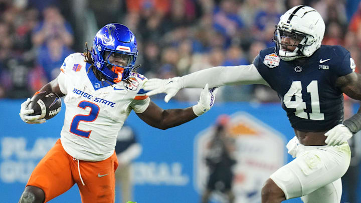 Boise State Broncos running back Ashton Jeanty (2) runs past Penn State Nittany Lions linebacker Kobe King (41)