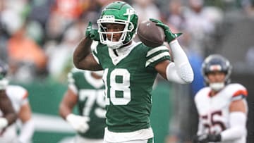 Sep 29, 2024; East Rutherford, New Jersey, USA; New York Jets wide receiver Mike Williams (18) celebrates a first down reception during the second half against the Denver Broncos at MetLife Stadium. Mandatory Credit: Vincent Carchietta-Imagn Images