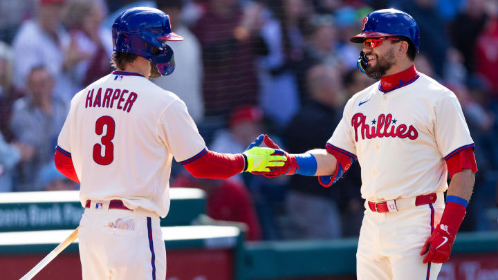 Apr 13, 2024; Philadelphia, Pennsylvania, USA; Philadelphia Phillies designated hitter Kyle Schwarber (12) celebrates with first base Bryce Harper (3) after hitting a home run during the first inning against the Pittsburgh Pirates at Citizens Bank Park