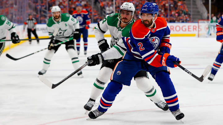 May 25, 2025; Edmonton, Alberta, CAN; Dallas Stars left wing Mason Marchment (27) and Edmonton Oilers defenseman Evan Bouchard (2) chase the puck during the second period in game three of the Western Conference Final of the 2025 Stanley Cup Playoffs at Rogers Place. Mandatory Credit: Perry Nelson-Imagn Images