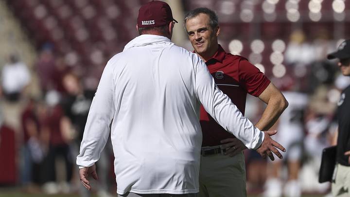 Nov 15, 2025; College Station, Texas, USA; South Carolina Gamecocks head coach Shane Beamer talks with Texas A&M Aggies head coach Mike Elko before the game at Kyle Field. Mandatory Credit: Troy Taormina-Imagn Images