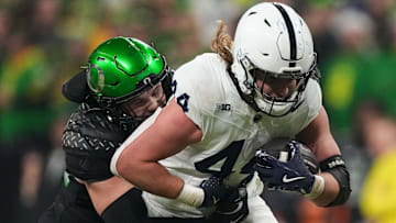 Bryce Boettcher corrals Penn State's Tyler Warren in the Big Ten Championship. To return there, the Ducks have to take it game by game