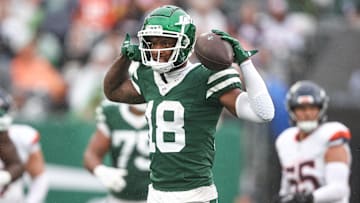 Sep 29, 2024; East Rutherford, New Jersey, USA; New York Jets wide receiver Mike Williams (18) celebrates a first down reception during the second half against the Denver Broncos at MetLife Stadium. Mandatory Credit: Vincent Carchietta-Imagn Images