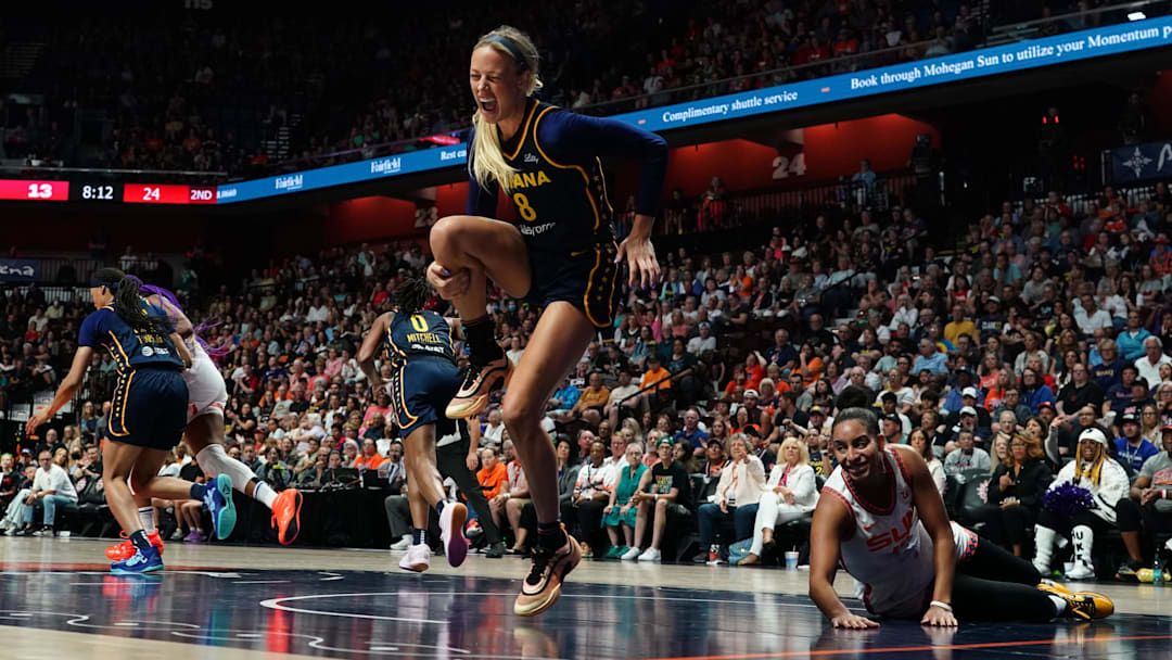 Aug 17, 2025; Uncasville, Connecticut, USA; Indiana Fever guard Sophie Cunningham (8) is injured on a play against Connecticut Sun guard Bria Hartley (14) in the first half at Mohegan Sun Arena. Mandatory Credit: David Butler II-Imagn Images