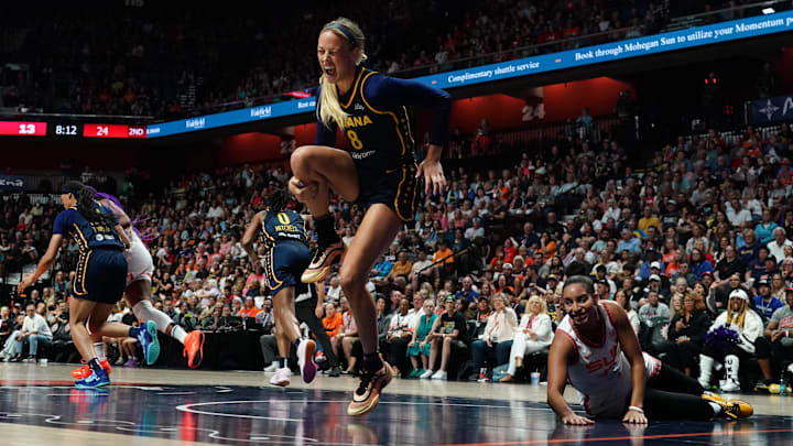 Aug 17, 2025; Uncasville, Connecticut, USA; Indiana Fever guard Sophie Cunningham (8) is injured on a play against Connecticut Sun guard Bria Hartley (14) in the first half at Mohegan Sun Arena. Mandatory Credit: David Butler II-Imagn Images