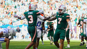 Nov 2, 2024; Miami Gardens, Florida, USA; Miami Hurricanes wide receiver Xavier Restrepo (7) celebrates with wide receiver Jacolby George (3) after scoring a touchdown against the Duke Blue Devils during the third quarter at Hard Rock Stadium. Mandatory Credit: Sam Navarro-Imagn Images