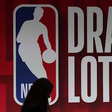 May 16, 2023; Chicago, IL, USA; People walk past the NBA Draft Lottery board at McCormick Place West. Mandatory Credit: David Banks-Imagn Images