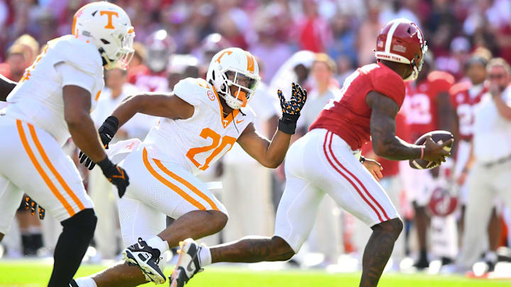 Alabama quarterback Jalen Milroe (4) is pressured by Tennessee defensive lineman Bryson Eason (20) during a football game between Tennessee and Alabama at Bryant-Denny Stadium in Tuscaloosa, Ala., on Saturday, Oct. 21, 2023.