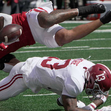 Wisconsin running back Chez Mellusi (1) fumbles the ball after being hit by Alabama defensive back Malachi Moore (13) during the second quarter of their game Saturday, September 14, 2024 at Camp Randall Stadium in Madison, Wisconsin. Alabama recovered the ball.