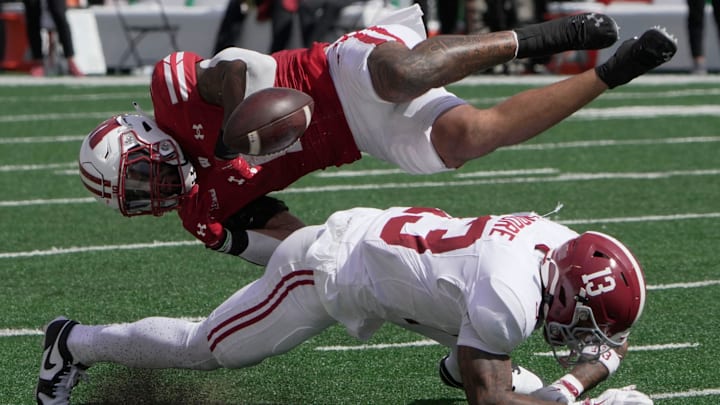 Wisconsin running back Chez Mellusi (1) fumbles the ball after being hit by Alabama defensive back Malachi Moore (13) during the second quarter of their game Saturday, September 14, 2024 at Camp Randall Stadium in Madison, Wisconsin. Alabama recovered the ball.