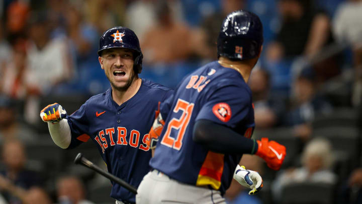 Aug 12, 2024; St. Petersburg, Florida, USA; Houston Astros third baseman Alex Bregman (2) celebrates with catcher Yainer Diaz (21) after hitting a home run against the Tampa Bay Rays in the first inning  at Tropicana Field. 