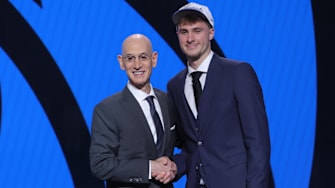 Cooper Flagg poses with NBA commissioner Adam Silver after being selected first overall by the Dallas Mavericks in the 2025 NBA Draft.