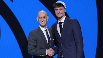 Cooper Flagg poses with NBA commissioner Adam Silver after being selected first overall by the Dallas Mavericks in the 2025 NBA Draft.
