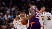 Oct 13, 2024; Denver, Colorado, USA; Denver Nuggets guard Russell Westbrook (4) guards Phoenix Suns guard Monte Morris (23) in the third quarter at Ball Arena. Mandatory Credit: Isaiah J. Downing-Imagn Images