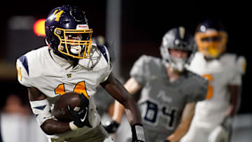 Webb’s Joel Wyatt (14) runs the ball against Pope John Paul II during the second half at Pope Saint John Paul II Preparatory School in Hendersonville, Tenn., Friday, Sept. 13, 2024.