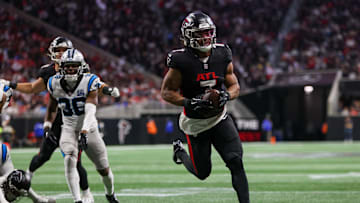 Jan 5, 2025; Atlanta, Georgia, USA; Atlanta Falcons running back Bijan Robinson (7) runs the ball for a touchdown against the Carolina Panthers in the second quarter at Mercedes-Benz Stadium. Mandatory Credit: Brett Davis-Imagn Images