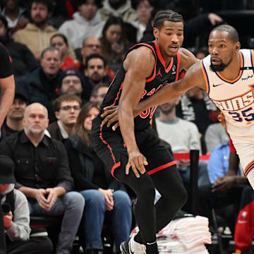 Feb 23, 2025; Toronto, Ontario, CAN; Phoenix Suns forward Kevin Durant (35) drives toward the basket against Toronto Raptors guard Ochai Agbaji (30) in the first half at Scotiabank Arena. Mandatory Credit: Dan Hamilton-Imagn Images