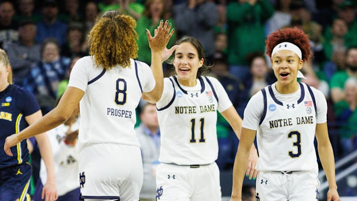Notre Dame guards Hannah Hidalgo (3), Sonia Citron (11) and Cassandre Prosper (8) celebrate during the second round of the NCAA Women's Basketball Tournament between Notre Dame and Michigan at Purcell Pavilion on Sunday, March 23, 2025, in South Bend. Notre Dame guards Hannah Hidalgo (3), Sonia Citron (11) and Cassandre Prosper (8) celebrate during the second round of the NCAA Women's Basketball Tournament between Notre Dame and Michigan at Purcell Pavilion on Sunday, March 23, 2025, in South Bend.